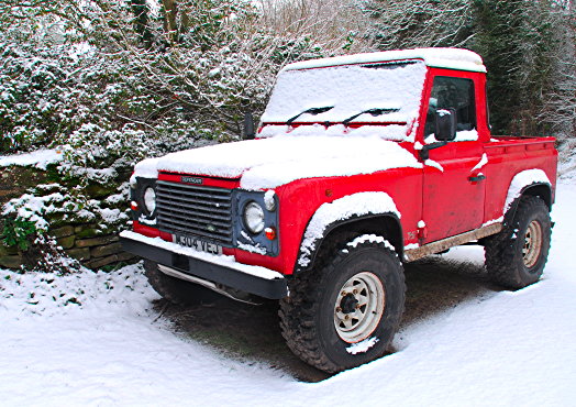 Land Rover Defender pickup in snow